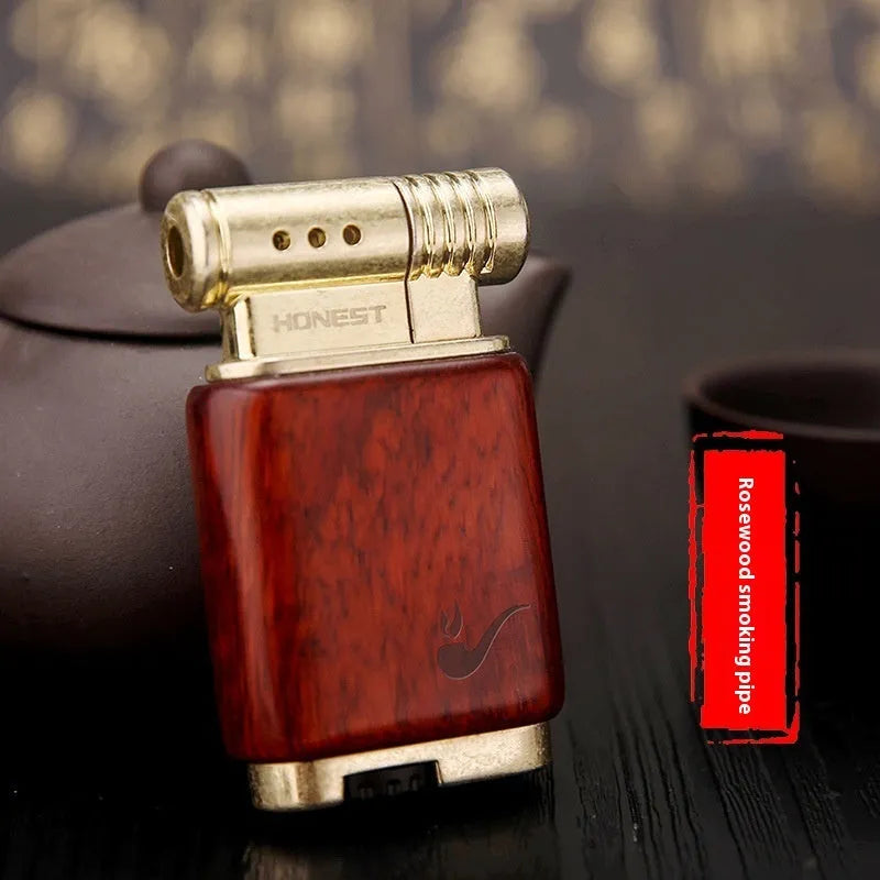 Ebony gas lighter with decorative rosewood and red wood carved panels