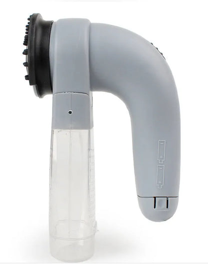Grey portable pet hair vacuum cleaner with soft rubber head for grooming cats and dogs.