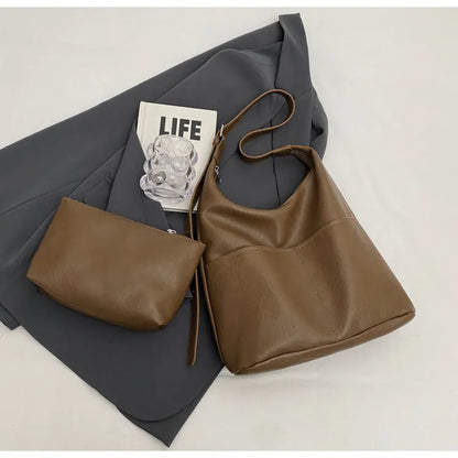 Women's soft PVC bucket shoulder bag with single strap, open pocket, phone pocket, and matching wallet