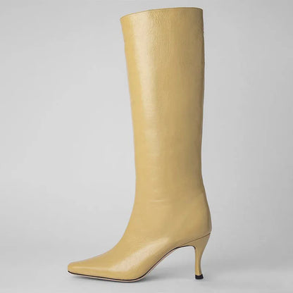 A pair of women's square toe cowboy boots in microfiber, shown in a selection of available colours.