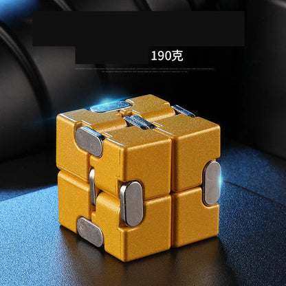 Zinc alloy Infinity Cube with eight rotating cubes showing black and silver colour options on wooden surface