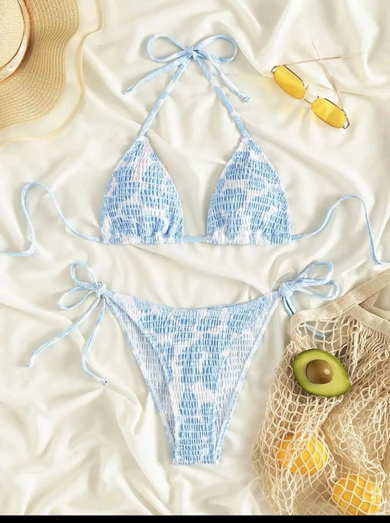 Women's floral halter neck swimsuit set in polyester fabric showing bra top and briefs