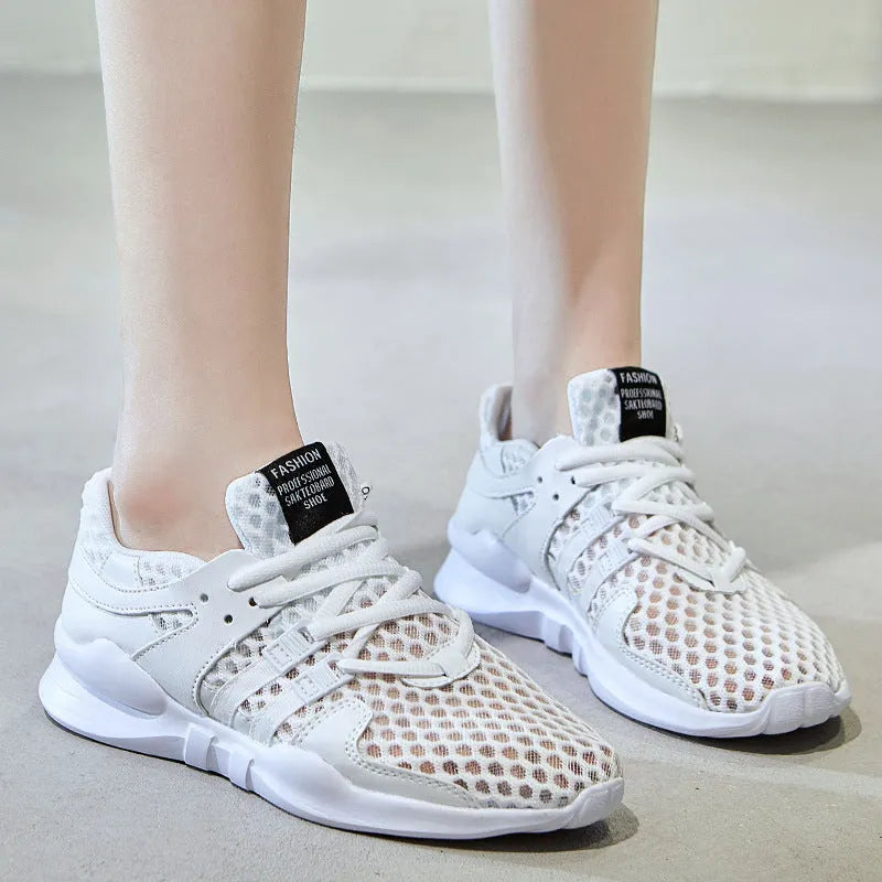Low-top casual sneaker in mesh with hollow-out design and round toe.