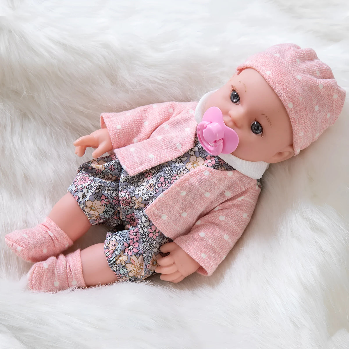 30cm full vinyl baby doll with changeable suit, available in TM-010 and TM-011 colours, for infants 0-3 years
