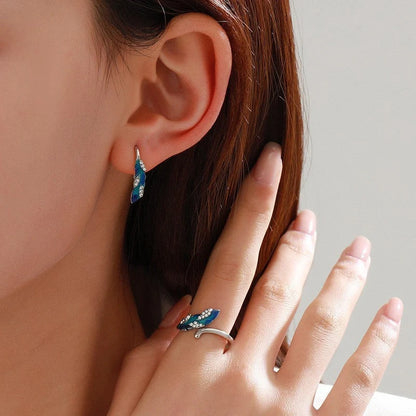 Bright blue feather earring and ring set in lightweight alloy with electroplated finish