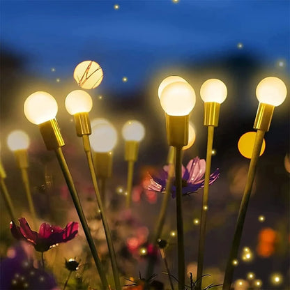 Solar-powered ground plug lawn light with automatic dusk-to-dawn operation and multiple head configurations