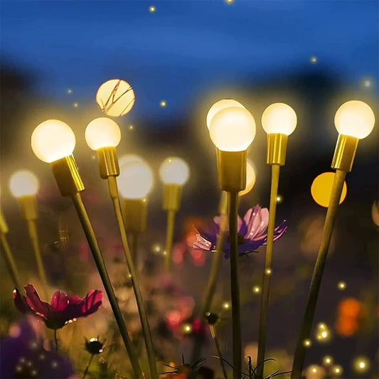 Solar-powered ground plug lawn light with automatic dusk-to-dawn operation and multiple head configurations