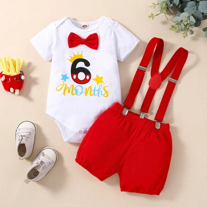 Red cotton baby romper with suspender shorts and printed letters for birthday celebrations