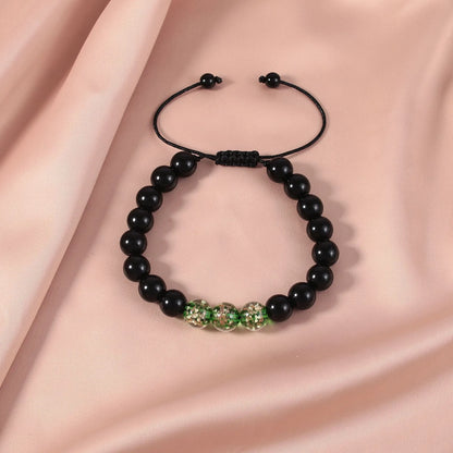 Adjustable bracelet with luminous geometric glass beads in six colour options on a wrist