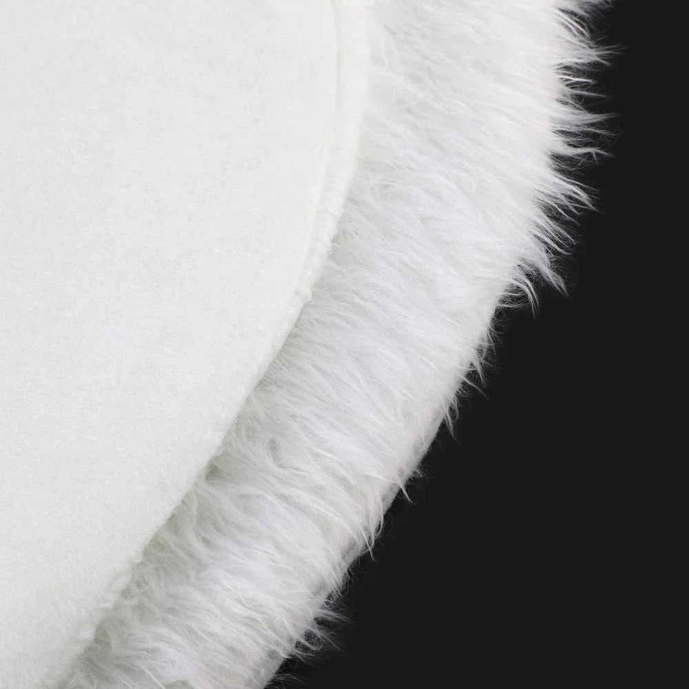 Luxurious plush white Christmas tree skirt with faux fur texture, perfect for holiday decor