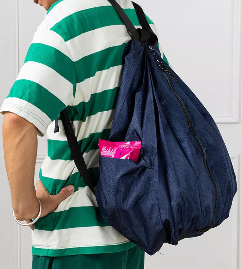 Women's waterproof foldable backpack in navy blue, perfect for outdoor and campus use