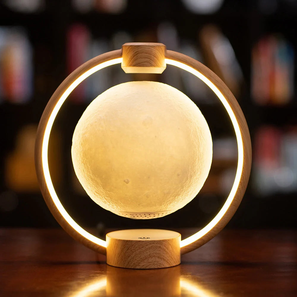 K1-Round Moon Bluetooth Speaker floating above wooden base with colorful lights