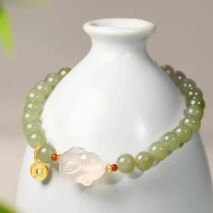 Handmade Hetian jade rabbit charm bracelet for women in glass or coloured glaze with a sweet rabbit design.