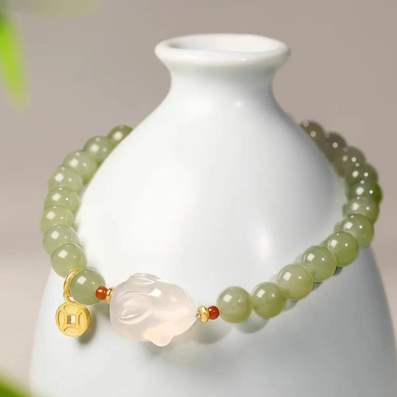 Hetian Jade Rabbit Bracelet for women, handmade glass and coloured glaze jewellery featuring a sweet animal charm, rabbit zodiac design, 8MM or 10MM charm size, suitable for gift-giving occasions like anniversaries, employee welfare or opening ceremonies.