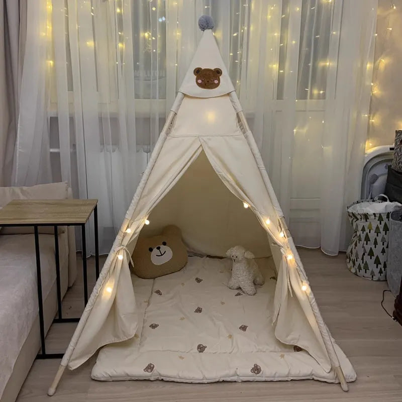 Beige indoor children's tent with cloth and wood construction, side door and hat style options for home play