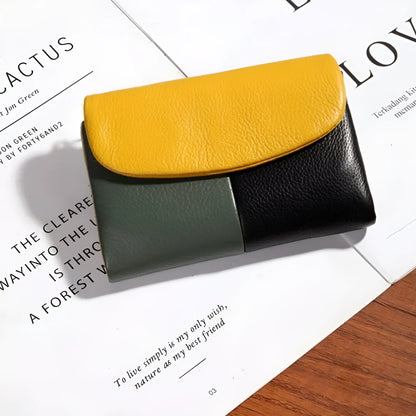 Women's short wallet in soft leather texture with solid colour and stitching detail, urban minimalist style
