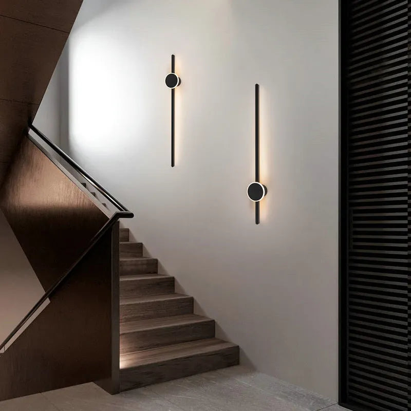 Modern strip wall lamp with acrylic shade mounted beside bed
