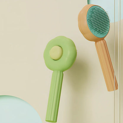 Sunflower design pet comb with stainless steel needles and one-click hair removal button