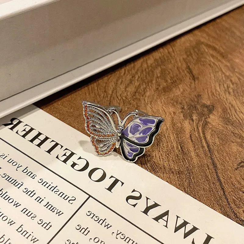 Copper women's ring with Chinese butterfly design and adjustable open loop.