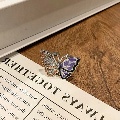 Copper women's ring with Chinese butterfly design and adjustable open loop.