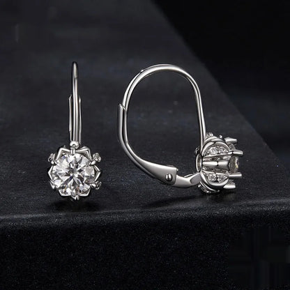 Sterling silver flower bud ear clips with white gold plating and moissanite centre stone