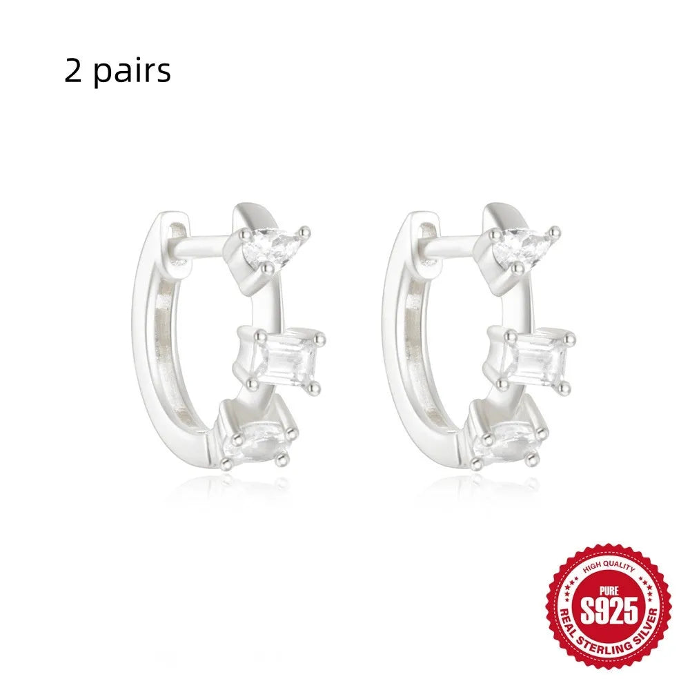 Sterling silver geometric stud earrings with small round diamond accents in gold or silver finish