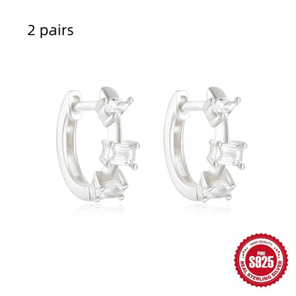 Sterling silver geometric stud earrings with small round diamond accents in gold or silver finish