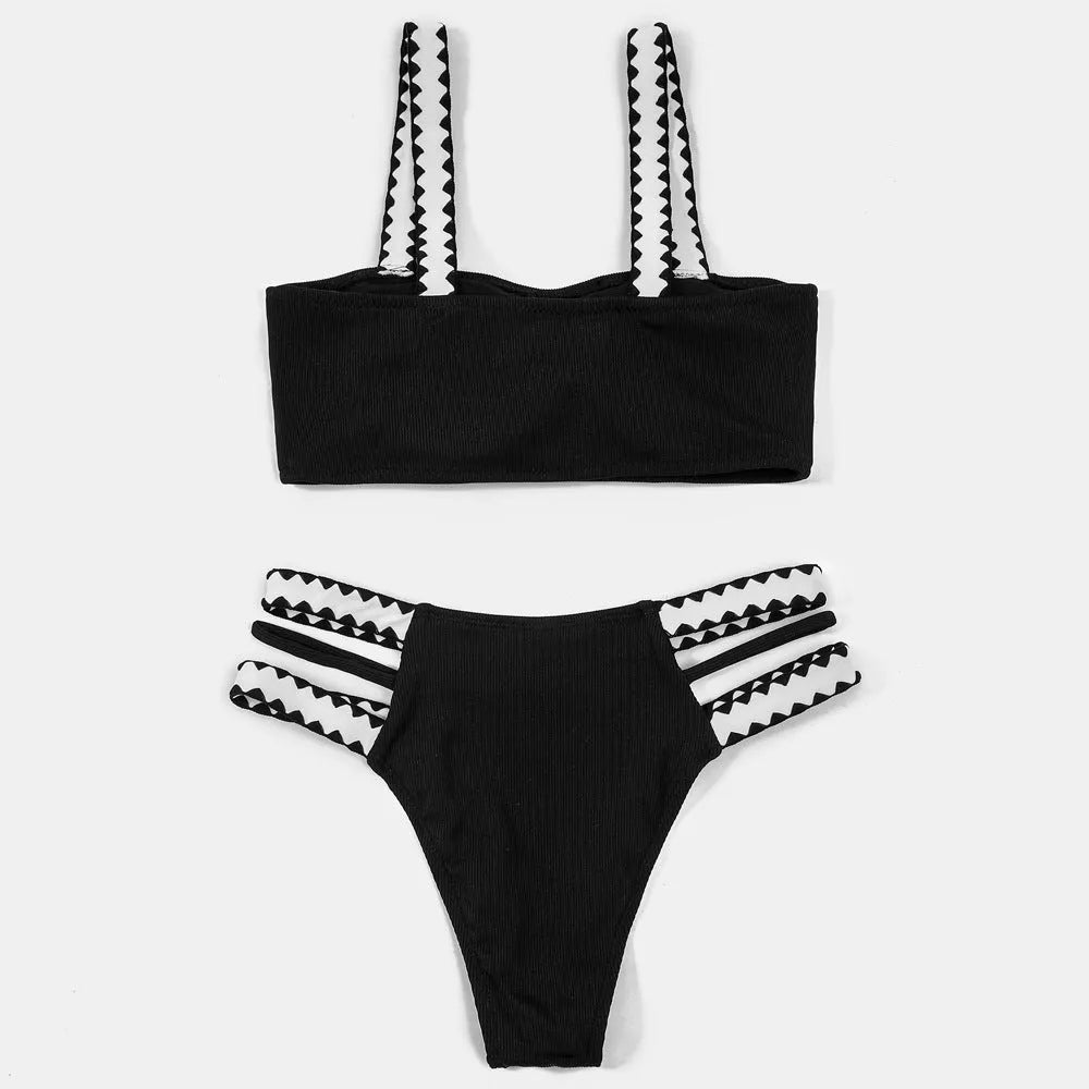 Black hollowed-out split briefs swimsuit for women made from polyester fabric