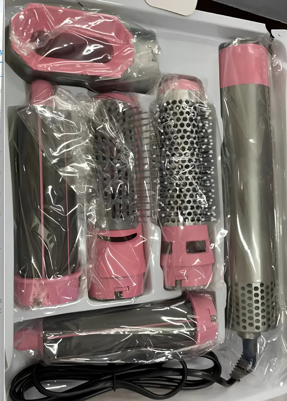 Multifunctional hot air curling iron in six colours with constant temperature technology and UK electrical compatibility