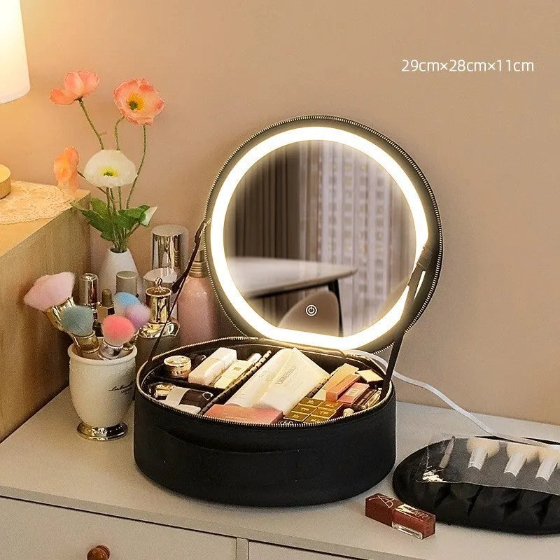Round black LED light makeup bag with built-in mirror, carry strap, and open compartment showing internal partitions.