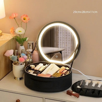 Round black LED light makeup bag with built-in mirror, carry strap, and open compartment showing internal partitions.