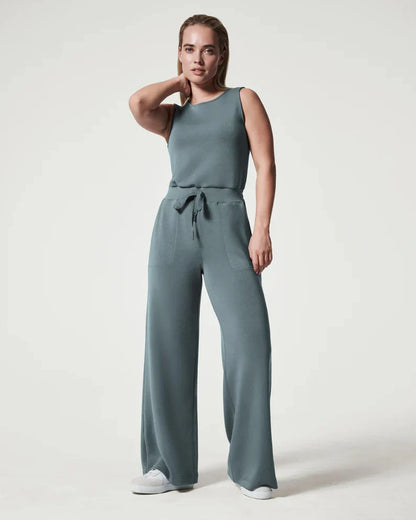 Women's lace-up jumpsuit pants in polyester, available in multiple colors and sizes for adjustable fit.