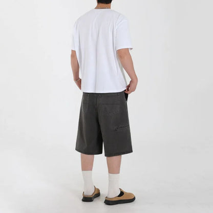Men's grey loose fit denim shorts with mid waist and zip fly, cropped length, sizes M to 2XL