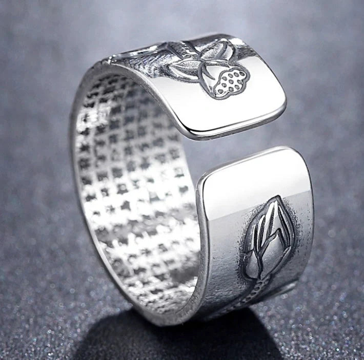 Handcrafted Thai sterling silver ring with intricate Heart Sutra engraving, promoting mental clarity and emotional balance.