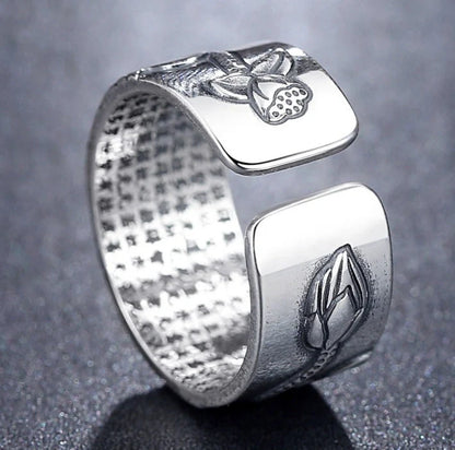 Handcrafted Thai sterling silver ring with intricate Heart Sutra engraving, promoting mental clarity and emotional balance.
