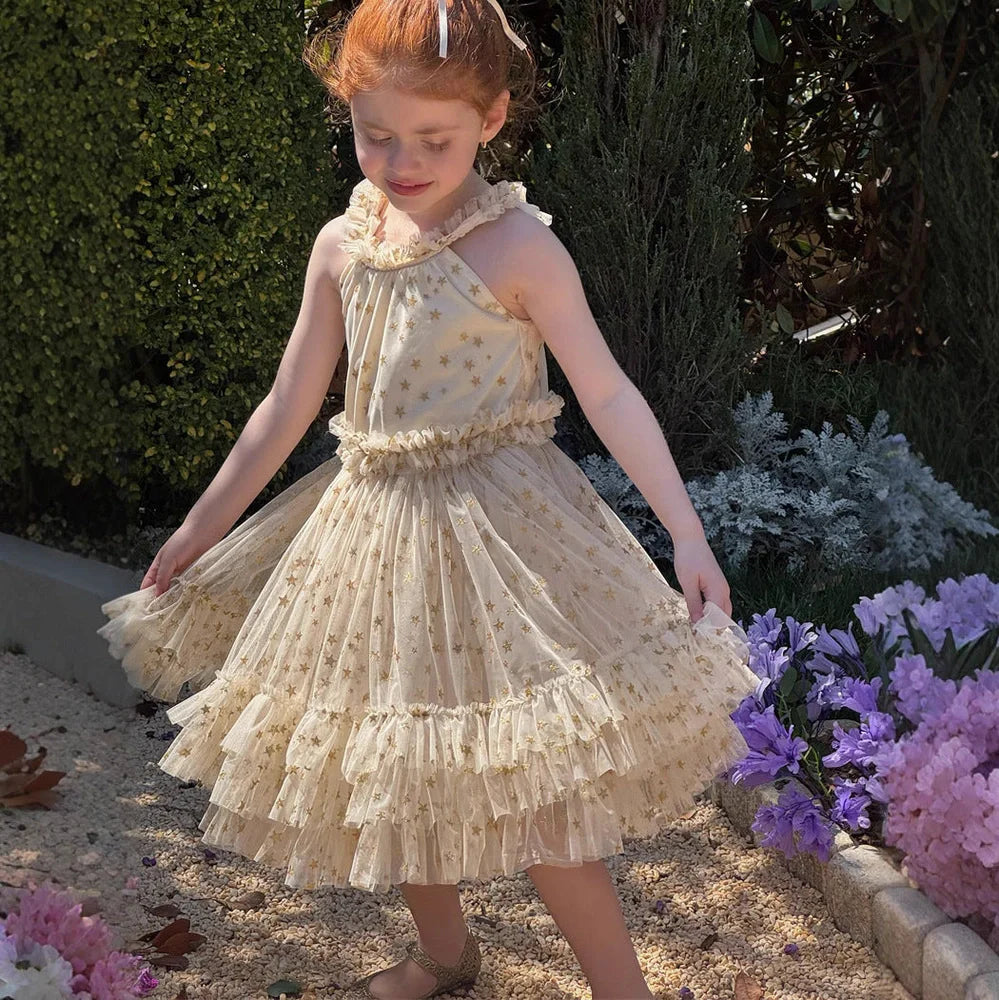 Apricot-coloured girls' halter neck tulle skirt with sleeveless design and floaty appearance