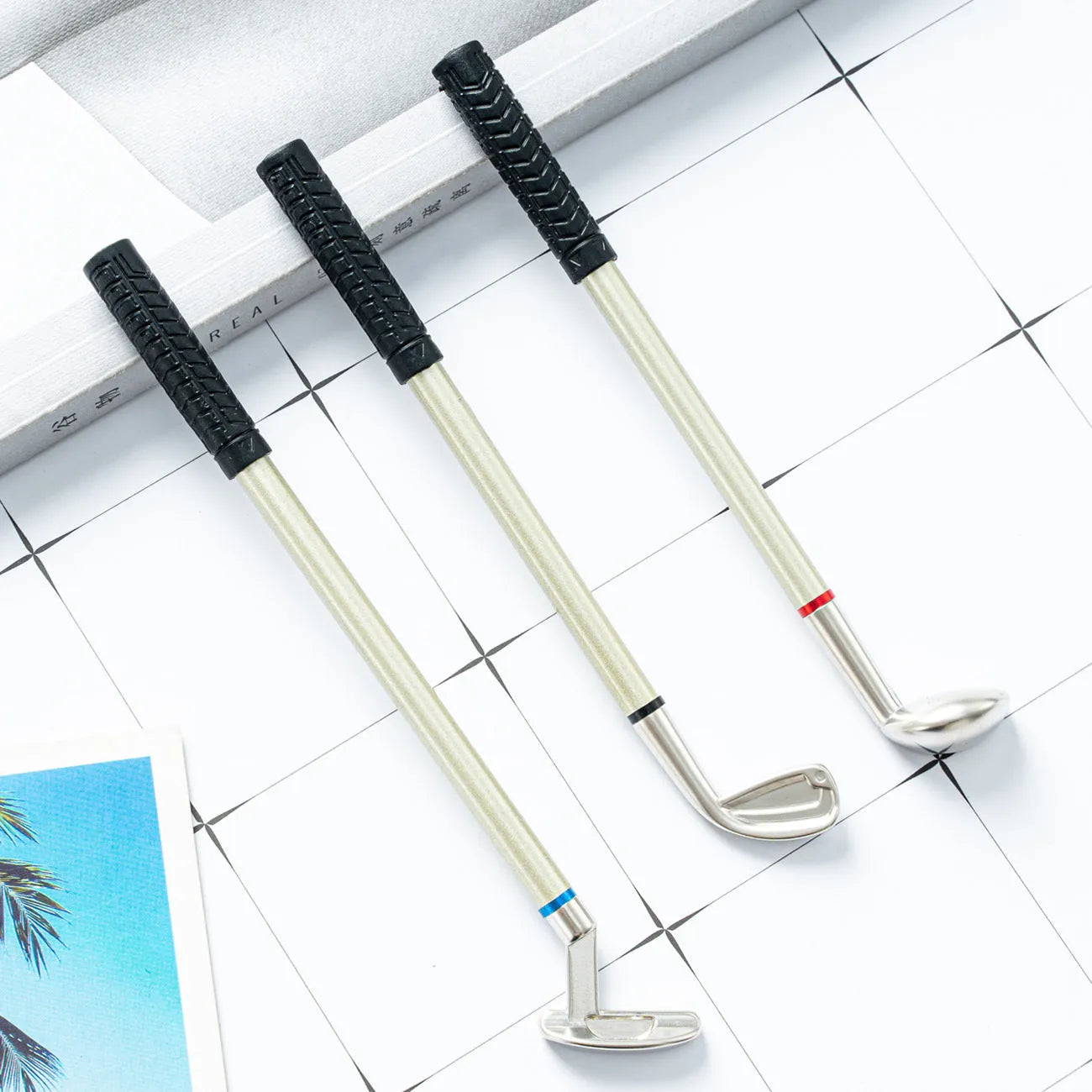 Three metal golf-themed ballpoint pens with 0.7mm bullet tips and normal suit colour refills