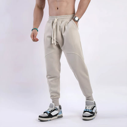 Men's casual trousers with drawstring ankle ties in polyester cotton fabric