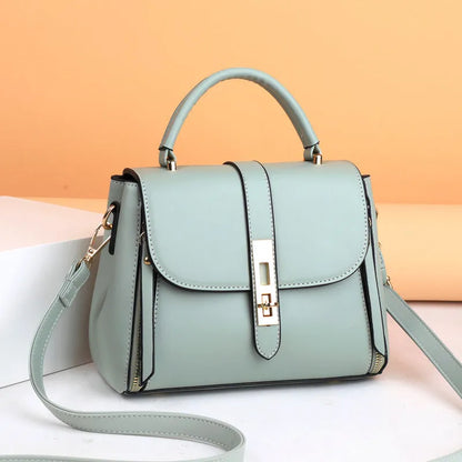 Women's soft black PU leather vertical messenger bag with adjustable strap, showing interior polyester lining.