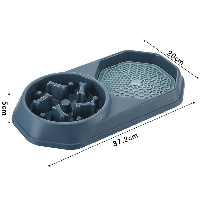 Blue interactive slow feeder dog bowl with maze pattern and non-slip base on a kitchen floor.
