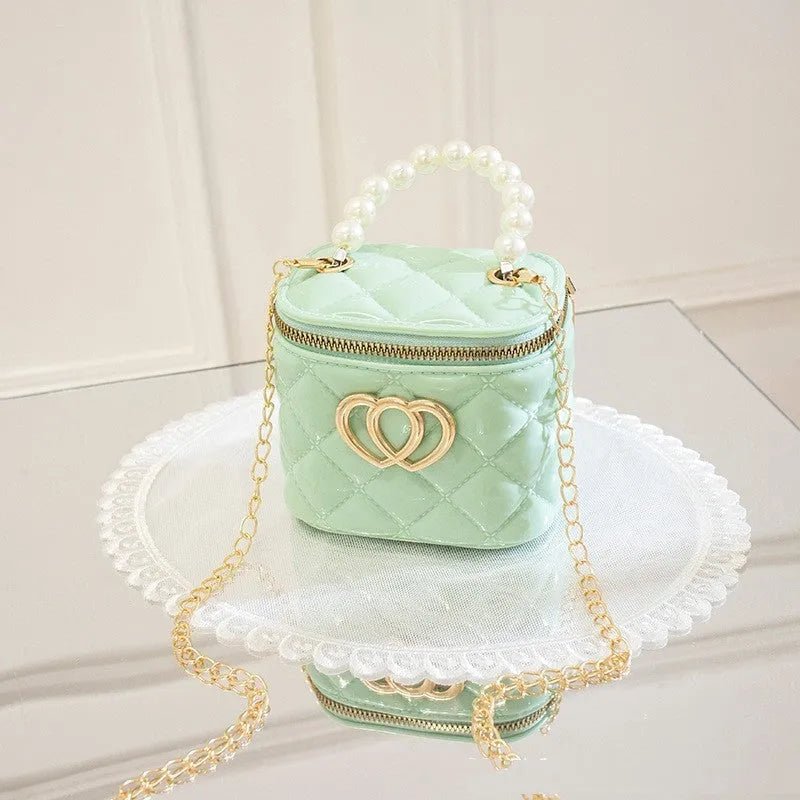 PVC bucket-style gel bag with a heart-shaped pattern, shown in apricot colour.