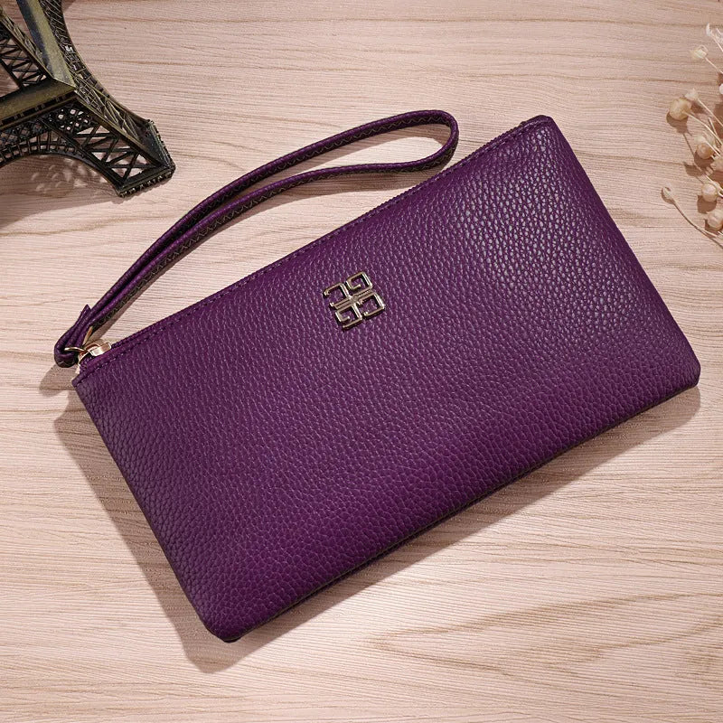 Long 55 cm PU leather wallet handbag in wine red colour with zipper closure open showing interior phone pocket and card slots