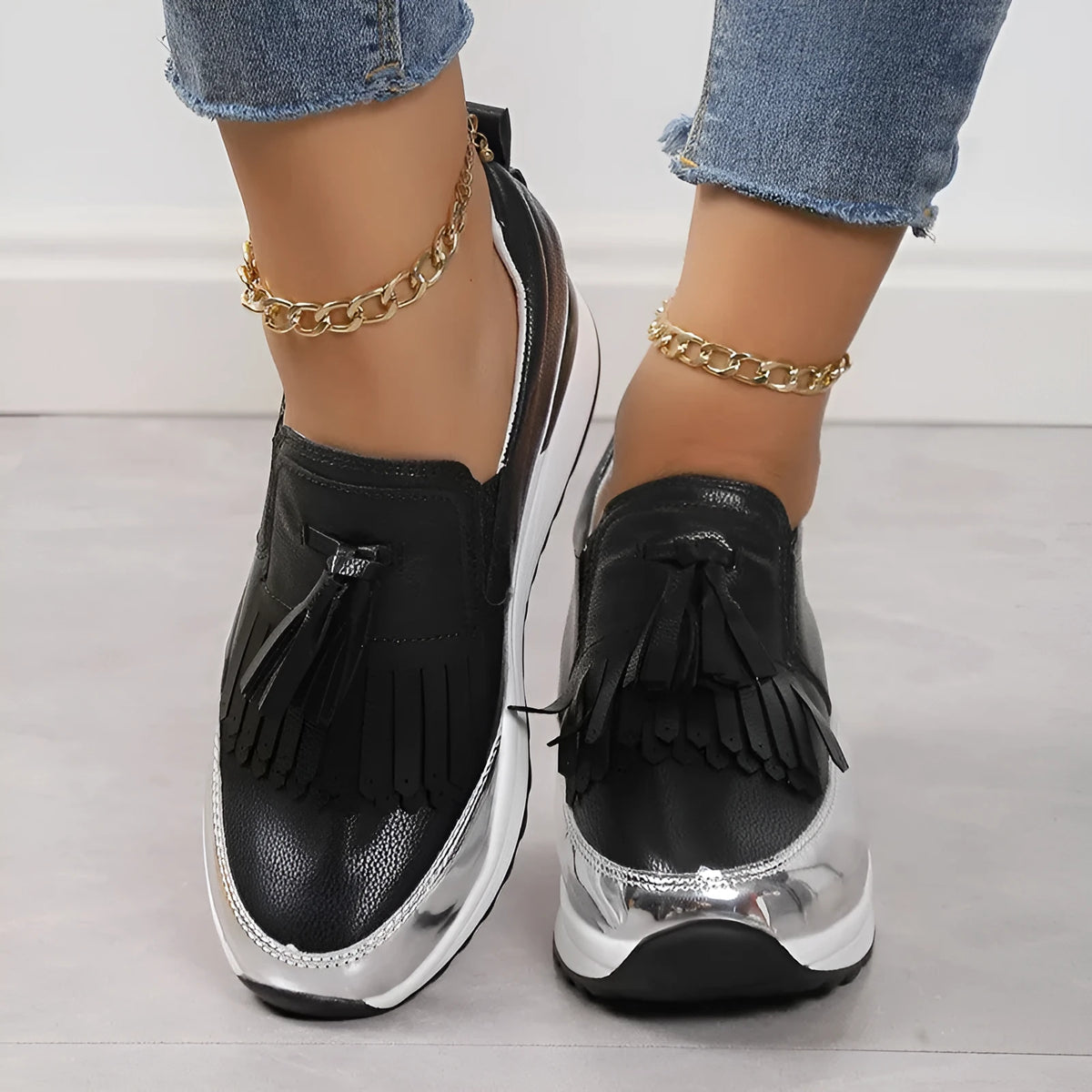 Women's black platform casual shoes with tassel detail and muffin wedge heel
