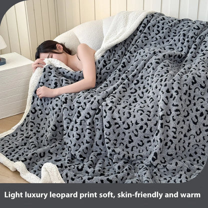 Double-layer cationic leopard jacquard taffeta blanket showing raised animal print pattern in available colour options