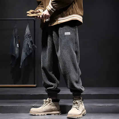 Men's grey casual sweatpants with ankle-tie design and straight leg cut