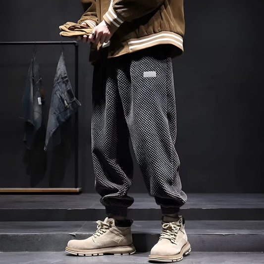 Men's grey casual sweatpants with ankle-tie design and straight leg cut