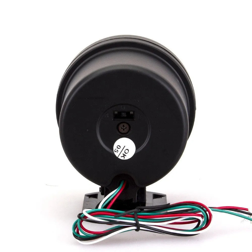 Black automotive tachometer with blue light pointer showing 0-8000 RPM scale.