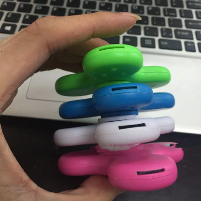 White Bluetooth speaker fidget spinner EDC toy with MP3 player functionality showing compact design