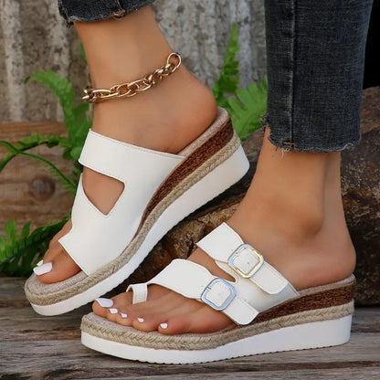 White patent leather wedge sandals with peep toe and finger fit design