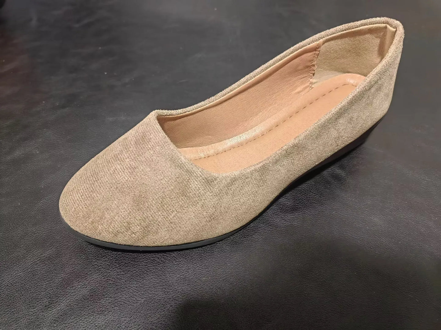 Women's black pointed toe wedge pumps with suede upper and low rubber sole